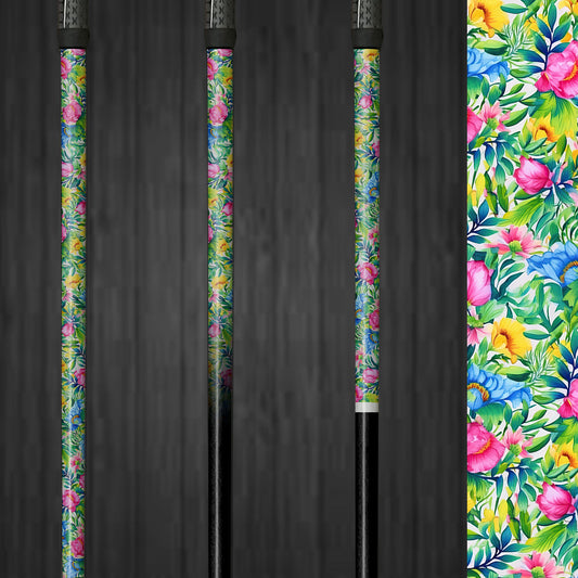 A golf club with a vinyl shaft wrap featuring a vibrant design of bright pink, blue, green, and yellow flowers. The wrap is applied smoothly, adding a colorful and custom look to the club. The lively floral pattern highlights the easy application and the cheerful, personalized style it brings to the golf shaft.