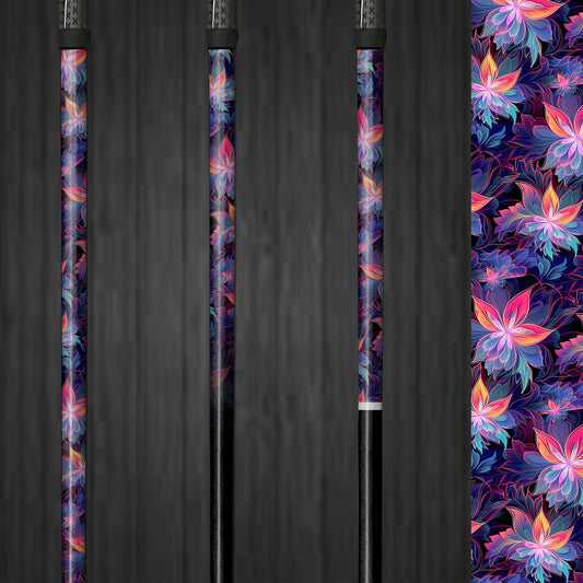 A golf club with a vinyl shaft wrap featuring bright purple, pink, and blue flowers. The wrap is smoothly applied, adding a vibrant and custom look to the club. The colorful floral design highlights the easy application and the lively, personalized style it brings to the golf shaft.