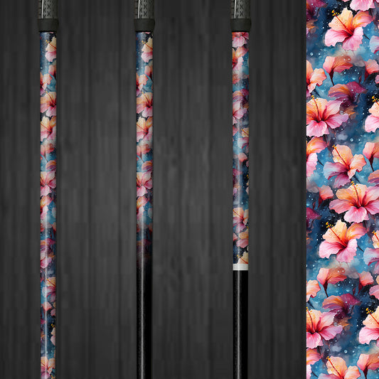 A golf club with a vinyl shaft wrap featuring soft pink and blue hibiscus flowers. The wrap is applied smoothly, adding a delicate and custom look to the club. The gentle floral design highlights the easy application and the elegant, personalized style it brings to the golf shaft.