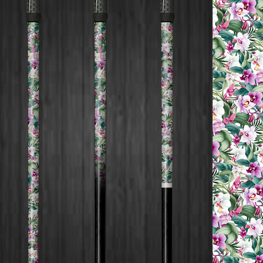 A golf club with a vinyl shaft wrap featuring soft purple, pink, and green orchid flowers on a white background. The wrap is applied smoothly, adding an elegant and custom look to the club. The delicate floral design highlights the easy application and the sophisticated style it brings to the golf shaft.